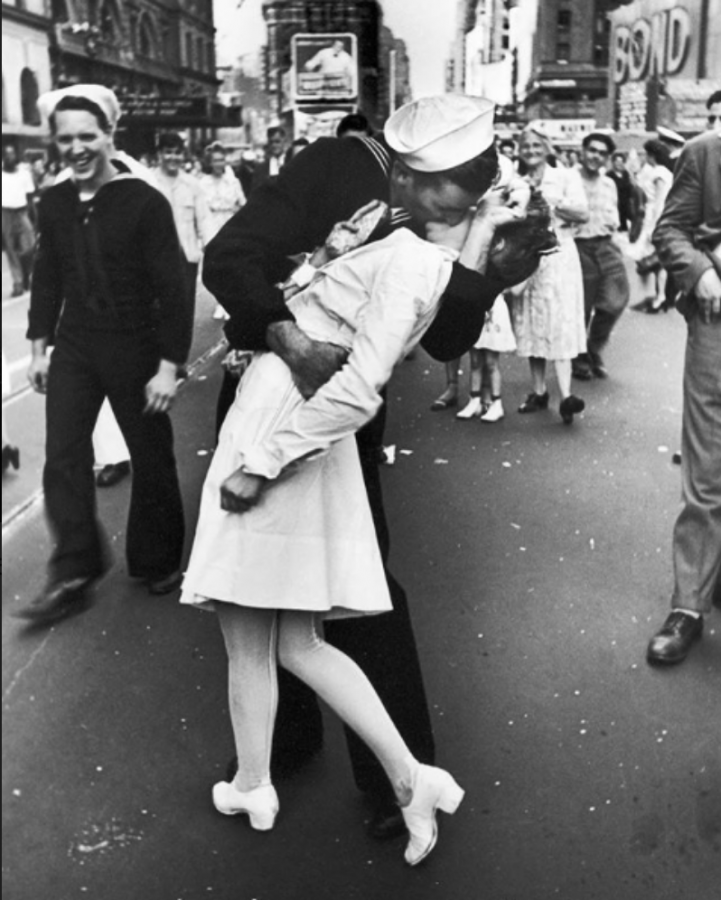 A sailor kissing a nurse passionately in celebration of the V-J Day. 